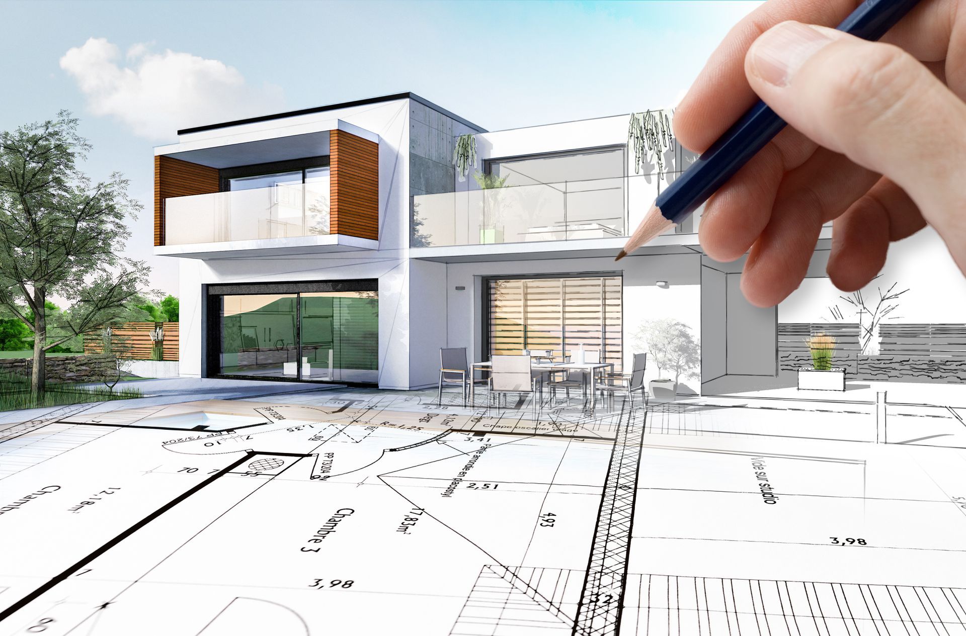 Architect sketching house plans with modern two-story house in background.