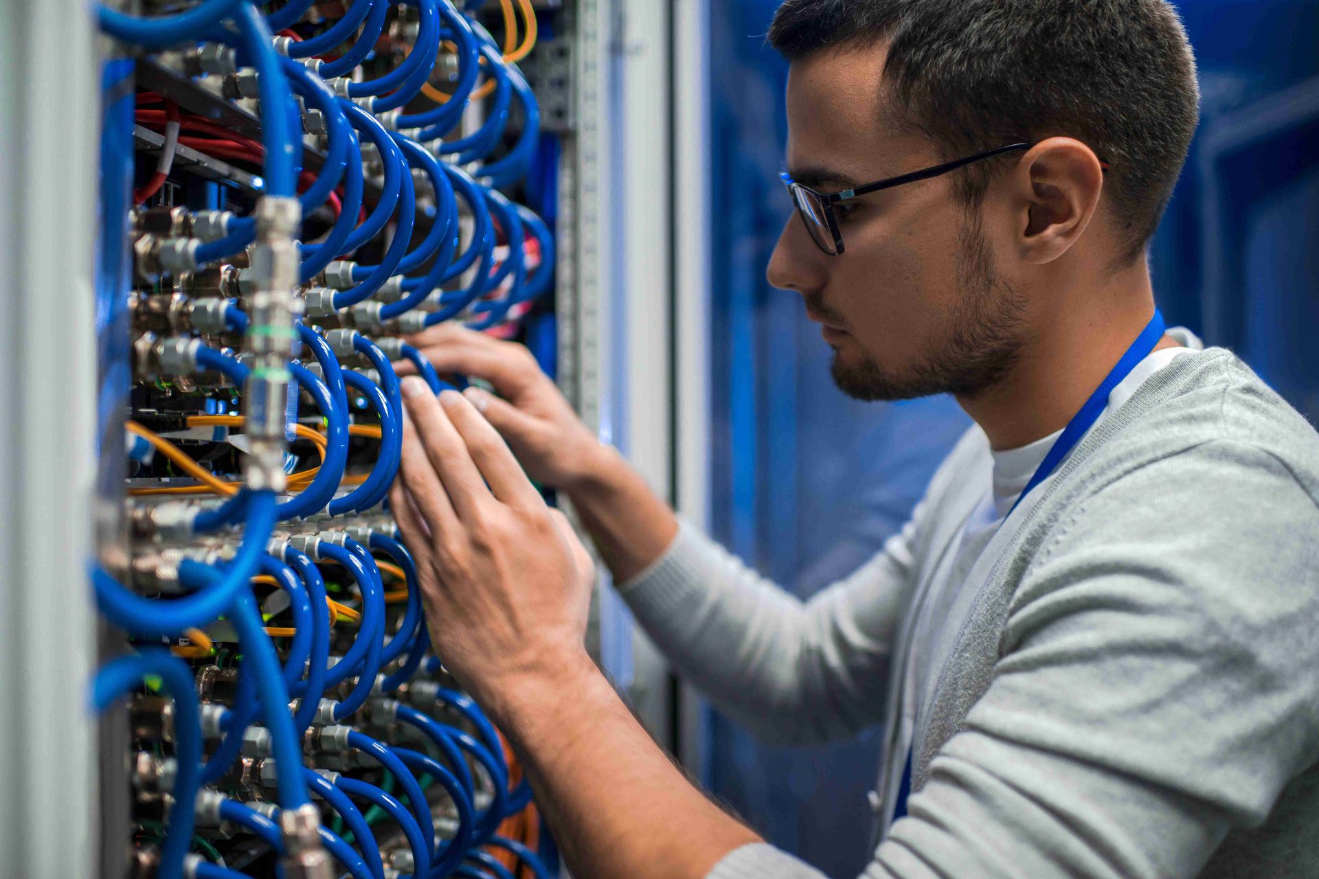 Man checking the network cables