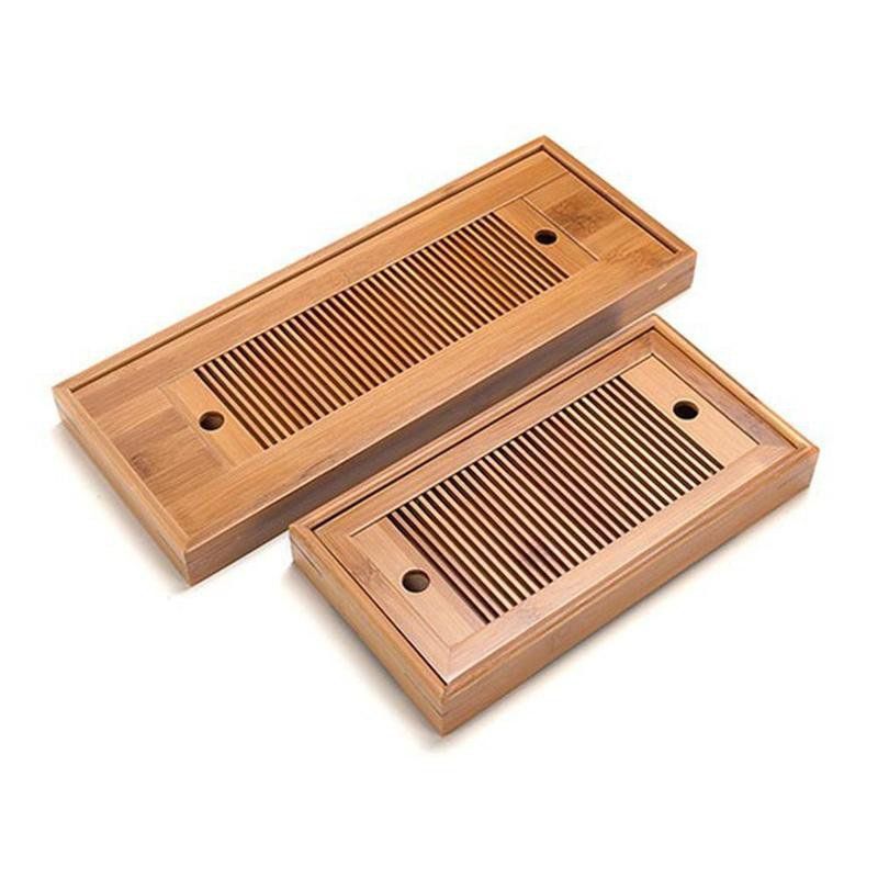 Two wooden trays with holes in them on a white background.