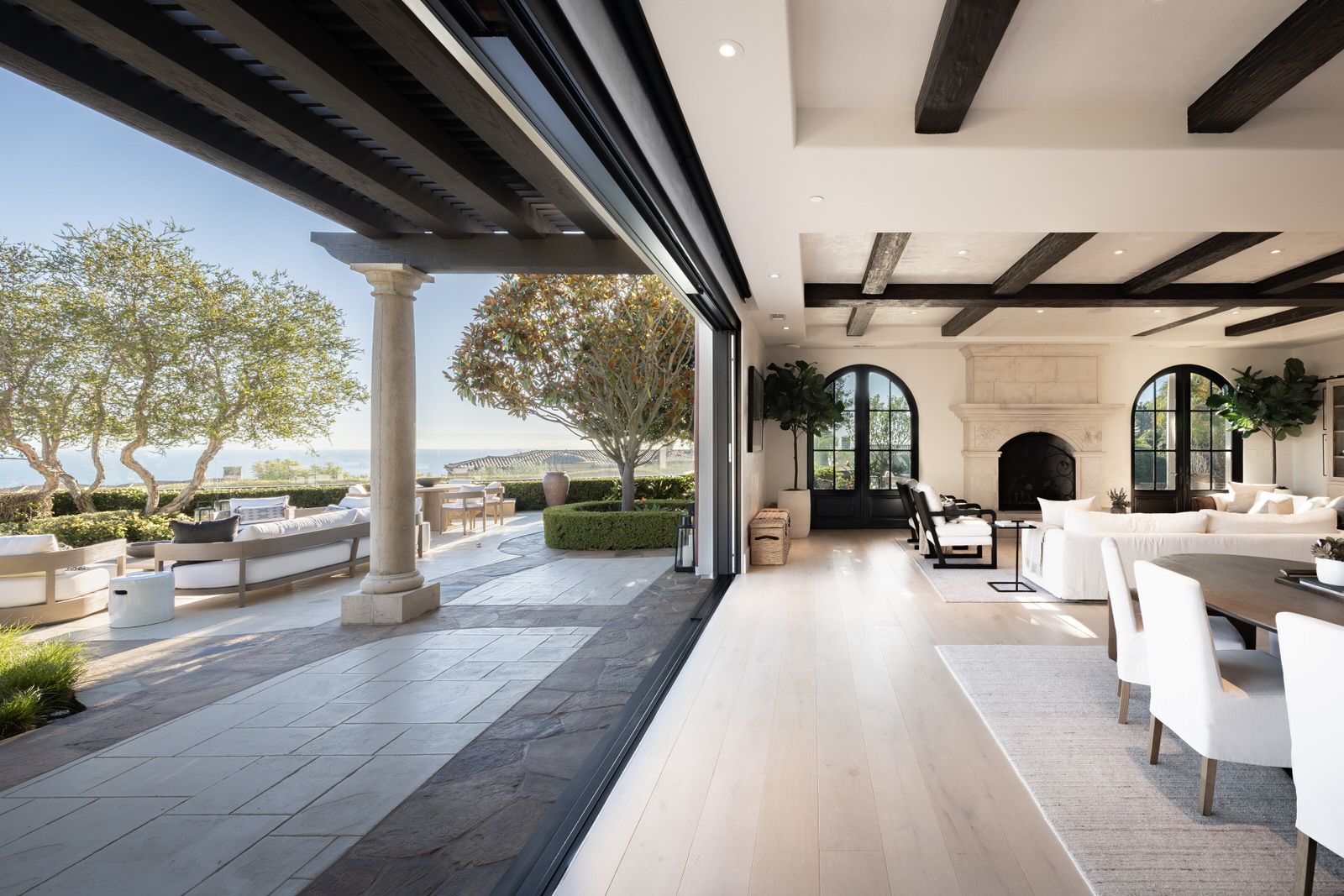 A living room with a sliding glass door leading to a patio.