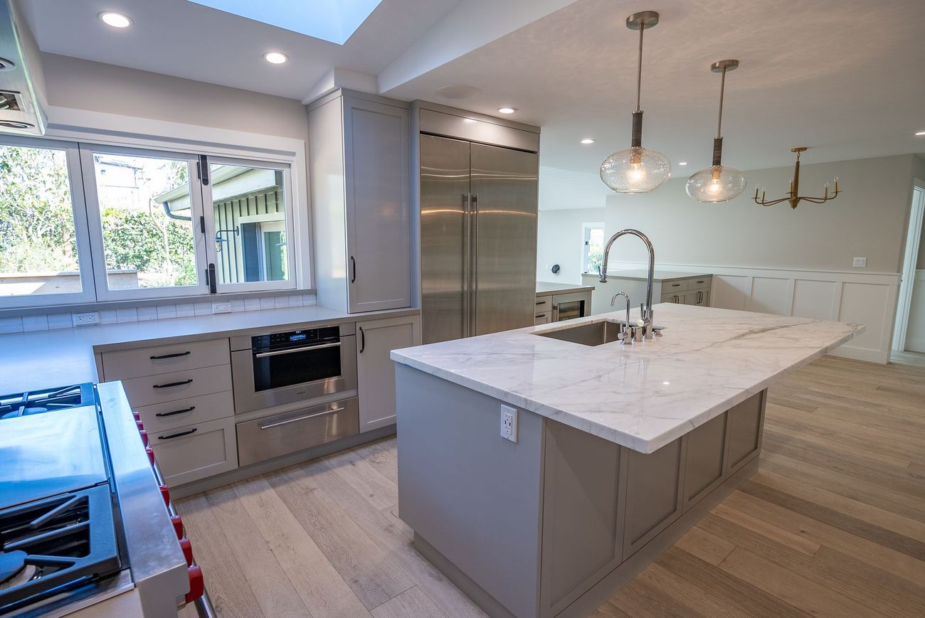 There is a large island in the middle of the kitchen.