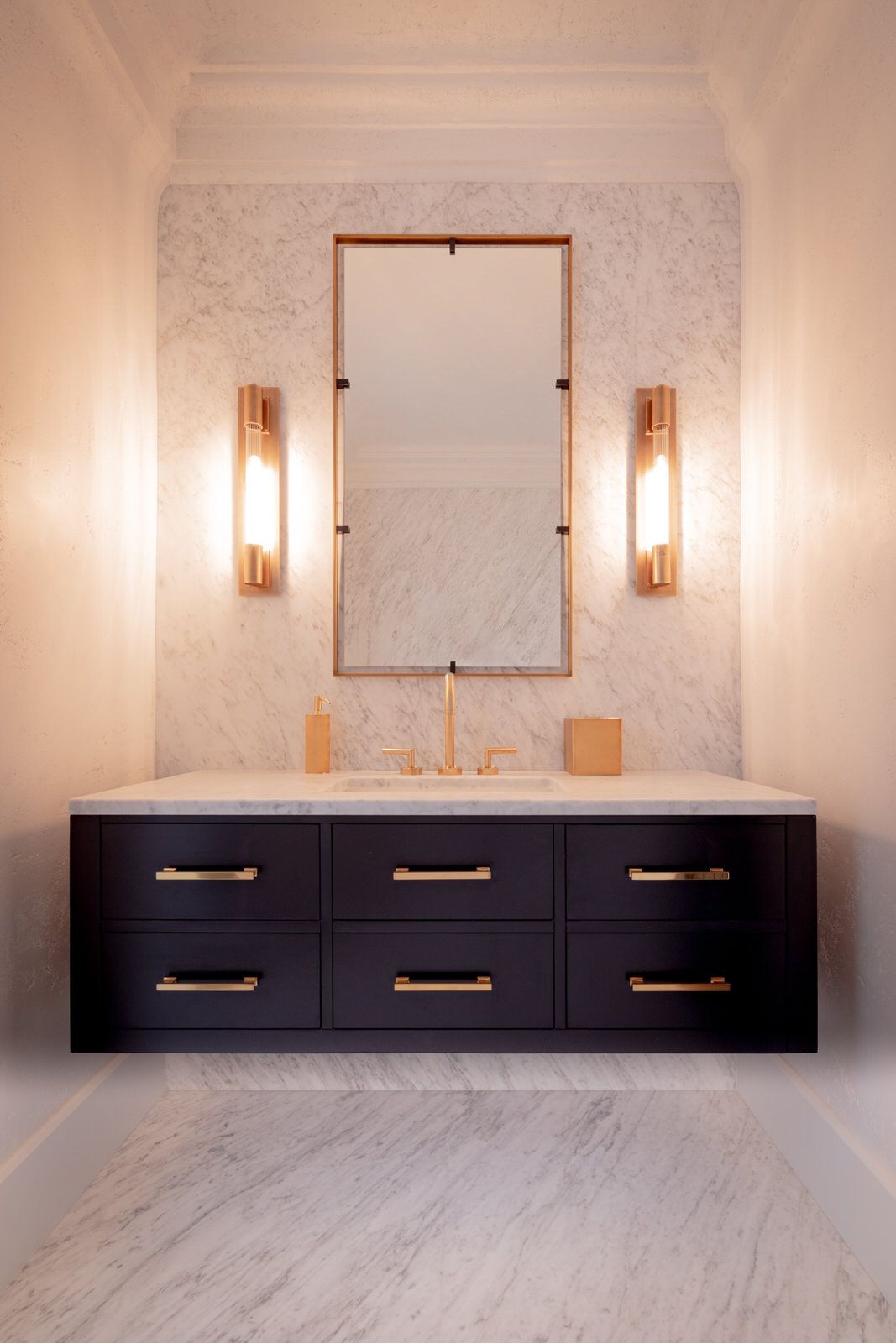 A bathroom with a sink and a mirror on the wall.