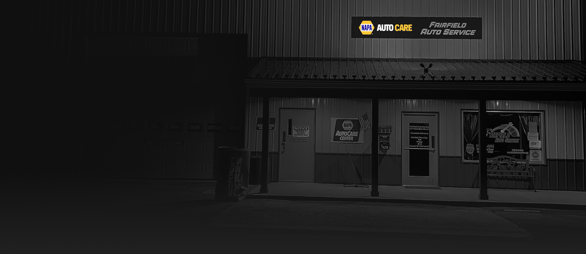 A dimly lit NAPA auto parts store at night.