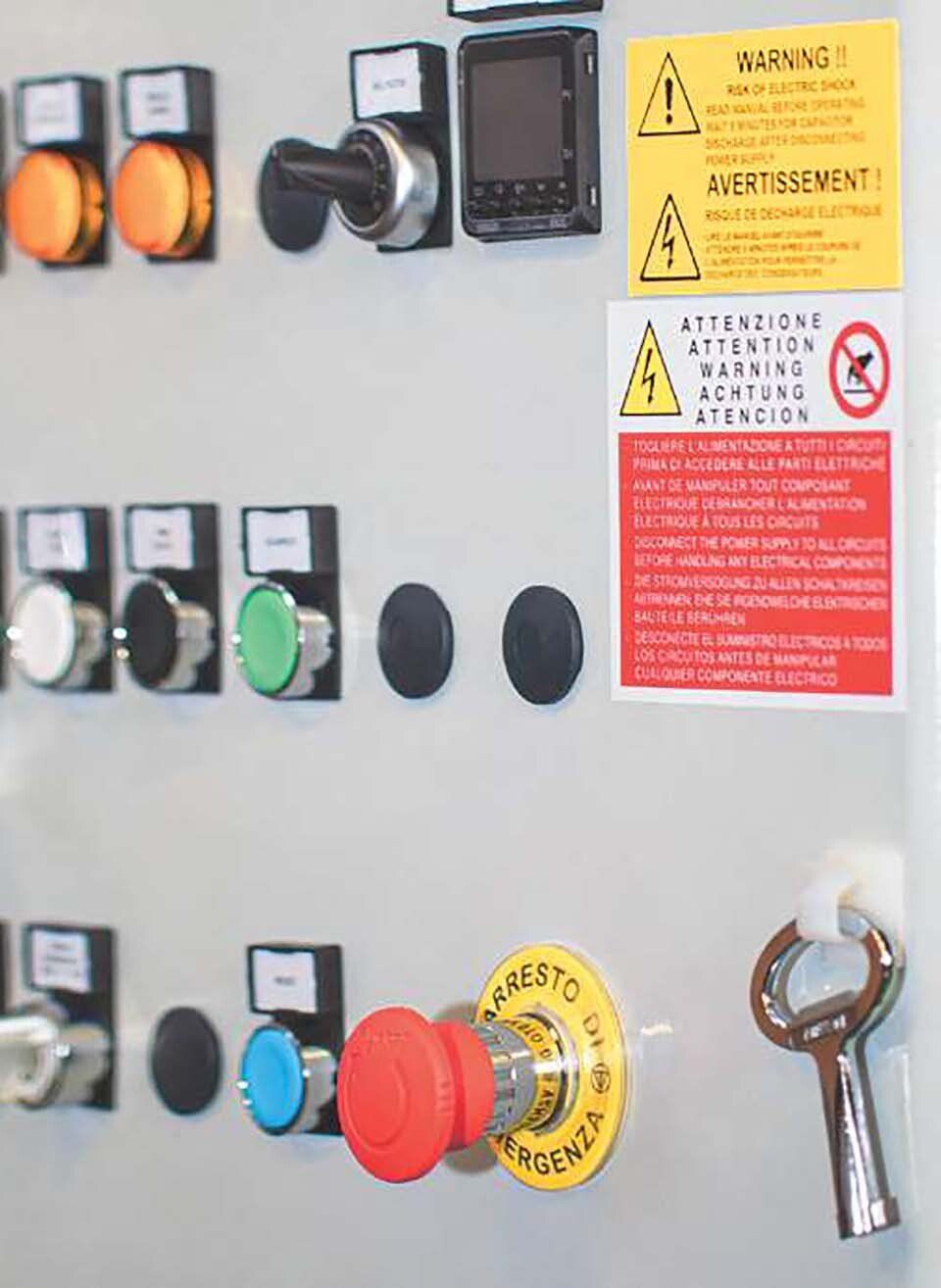 control panel of an installation with coloured buttons