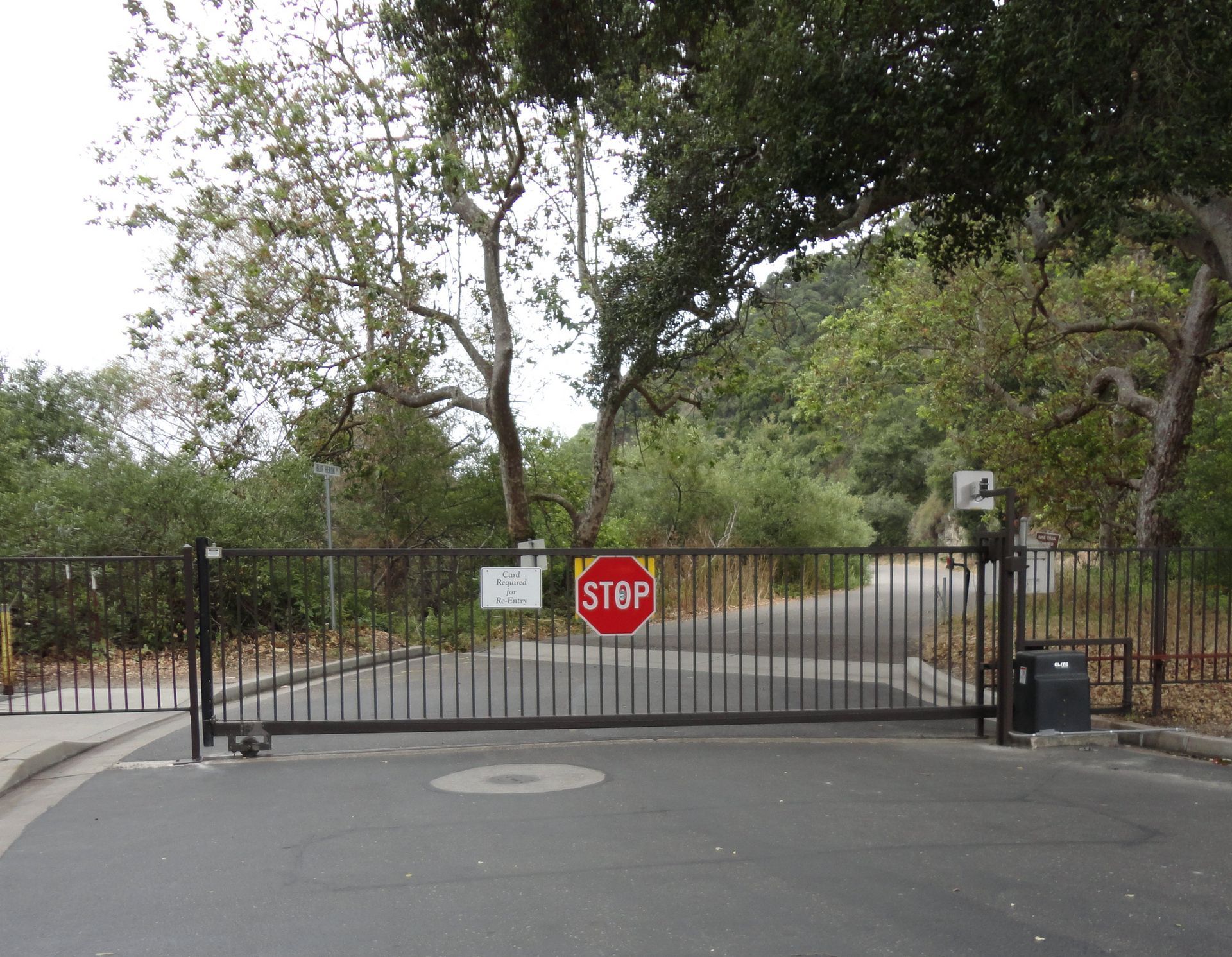 a stop sign is on a gate that is closed