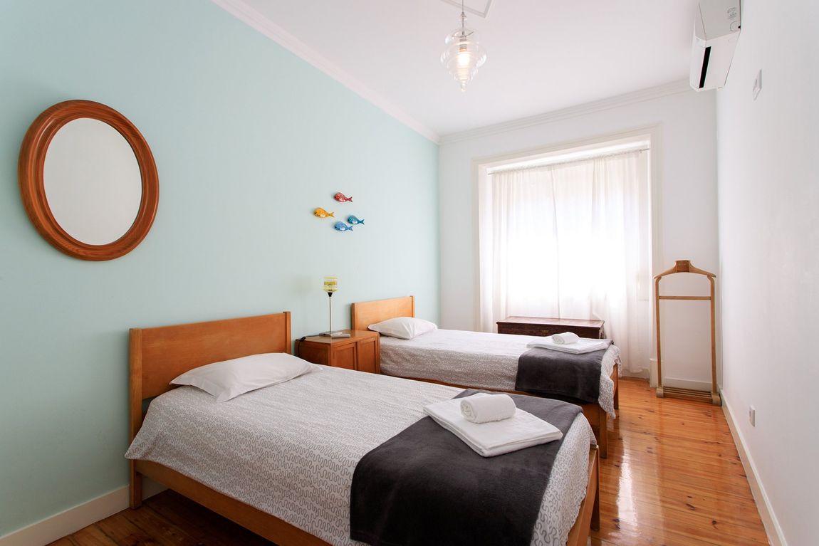 Casas d'Almedina quarto com duas camas em apartamento no intendente