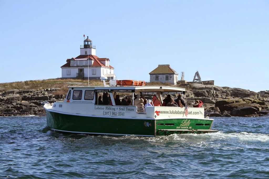 LuLu Lobster Boat Ride in water near lighthouse