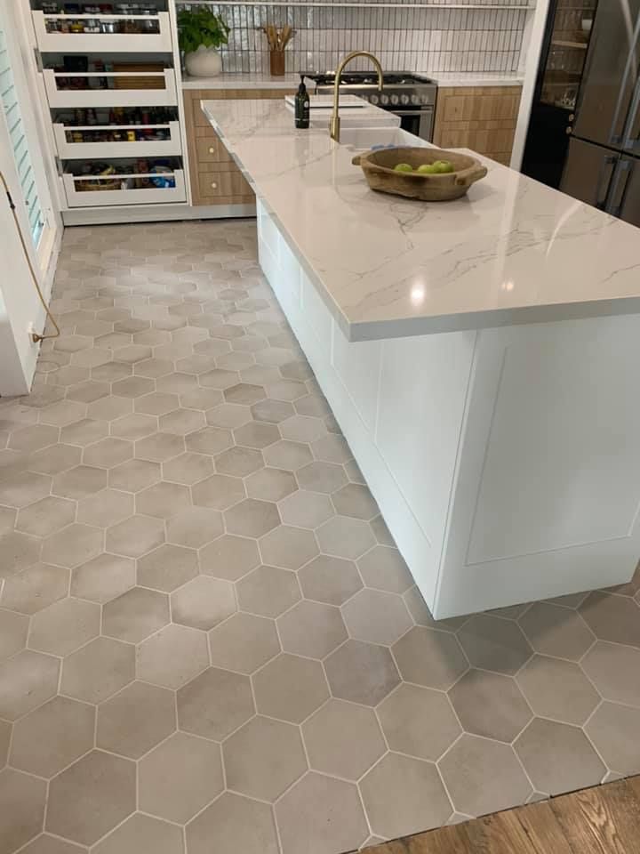 A Kitchen With Stainless Steel Appliances and a Fire Extinguisher — ASpect Wall & Floor Tiling in Charmhaven, NSW
