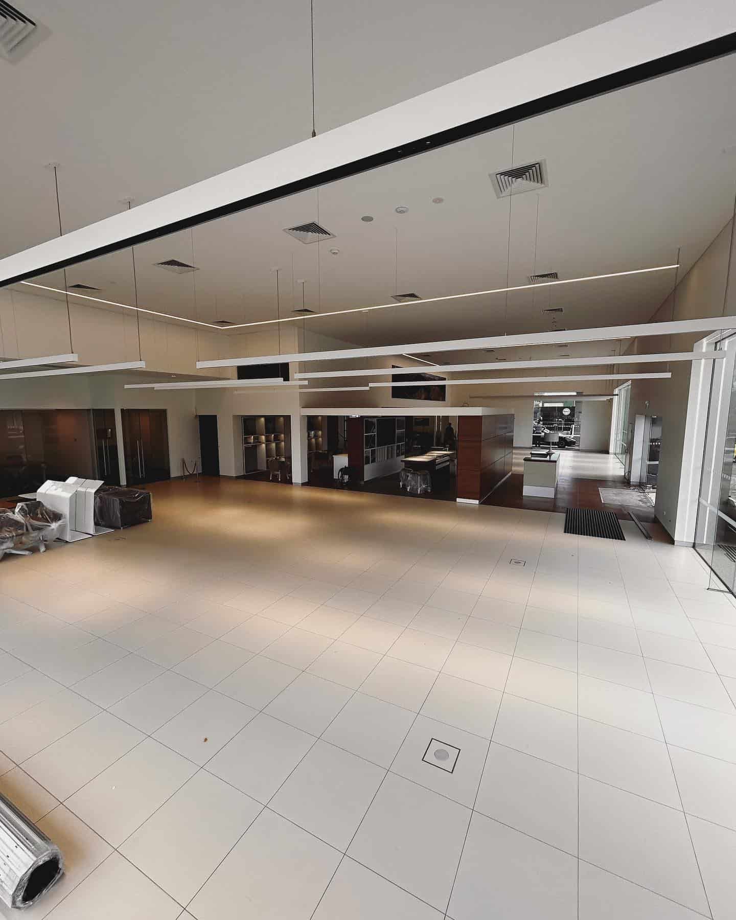 A Large Room With a Lot of Windows and Lights on the Ceiling — ASpect Wall & Floor Tiling in Charmhaven, NSW