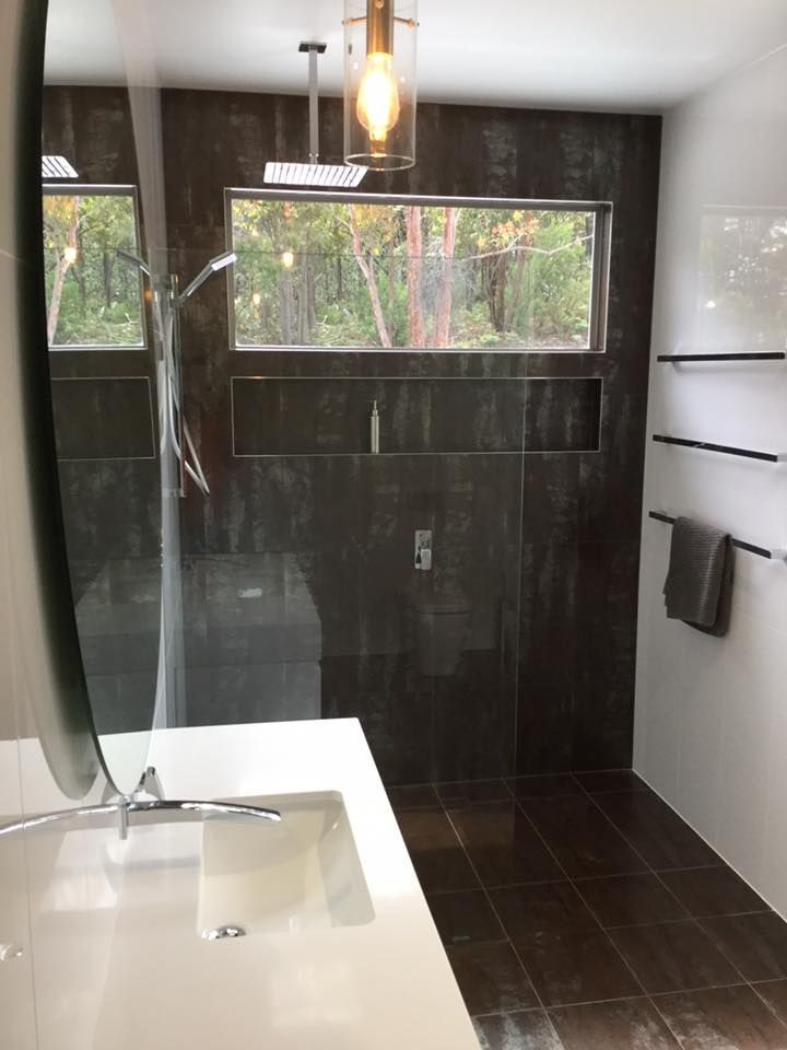 A Bathroom With a Sink and a Walk in Shower — ASpect Wall & Floor Tiling in Charmhaven, NSW