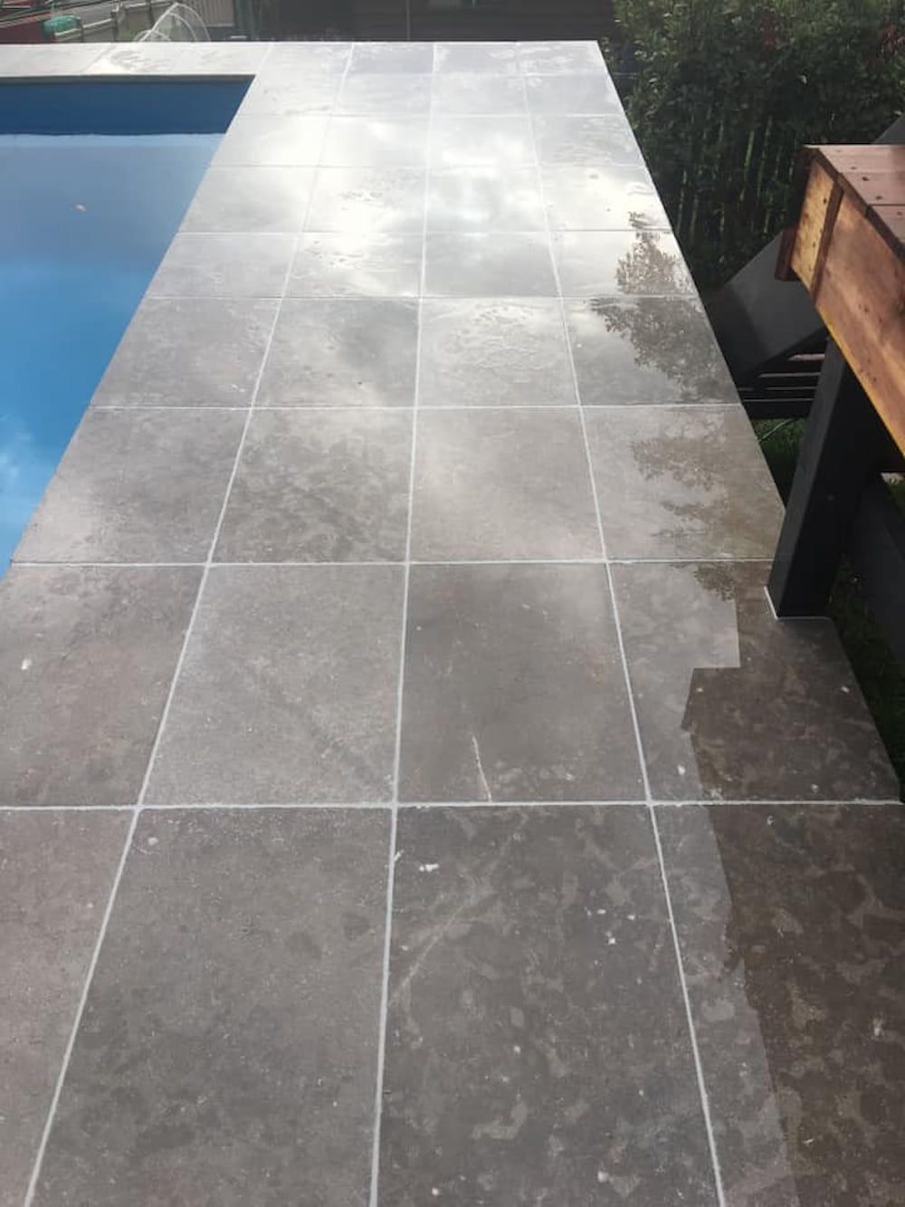 A Tiled Walkway Leading To A Swimming Pool — ASpect Wall & Floor Tiling in Taree, NSW