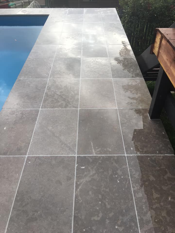 A Tiled Walkway Leading to a Swimming Pool — ASpect Wall & Floor Tiling in Forster, NSW