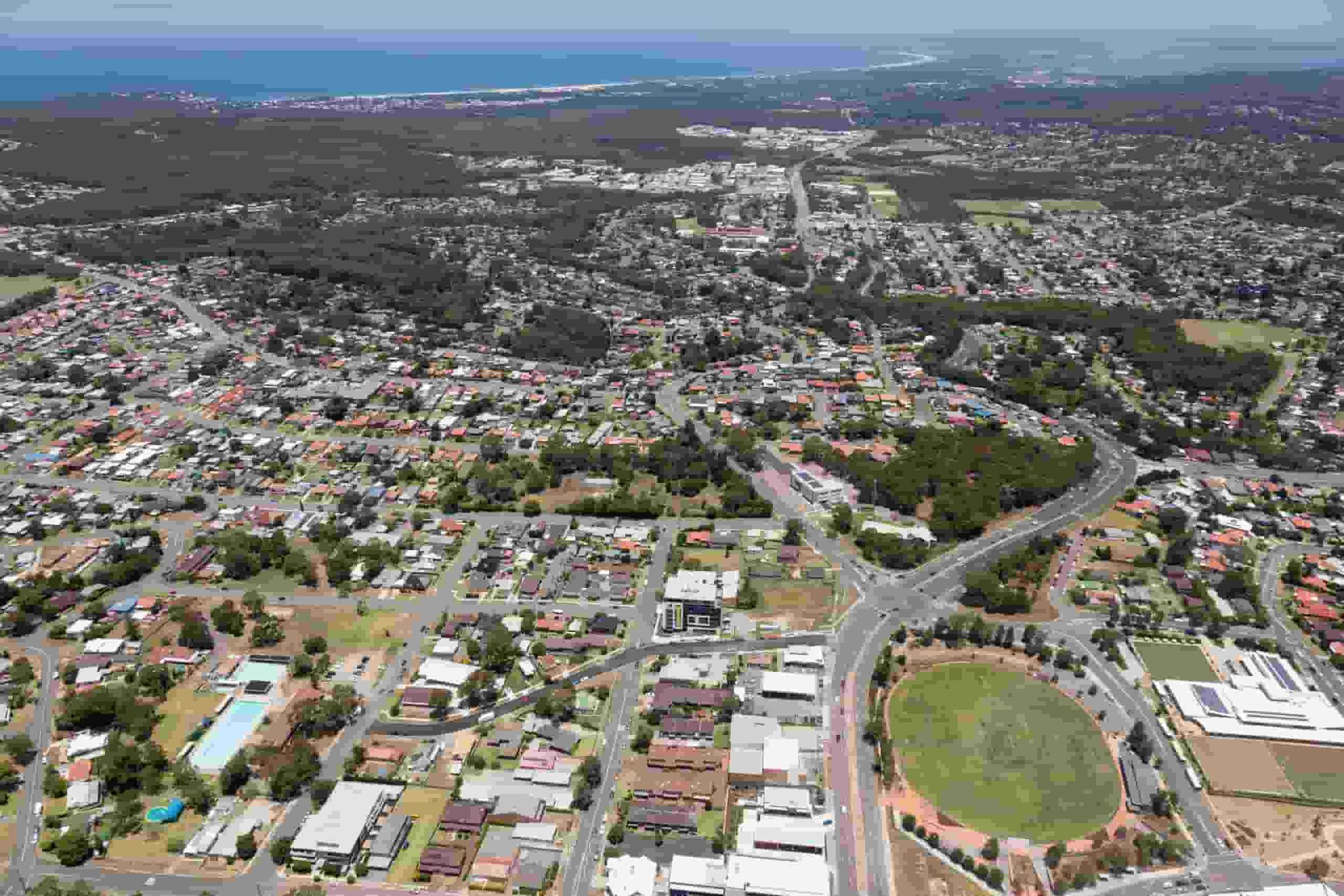 An Aerial View of a City With Lots of Houses and Trees — ASpect Wall & Floor Tiling in Newcastle, NSW