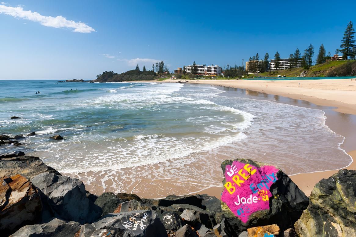 Ocean Waves Crashing on a Sandy Beach — ASpect Wall & Floor Tiling in Port Macquarie, NSW