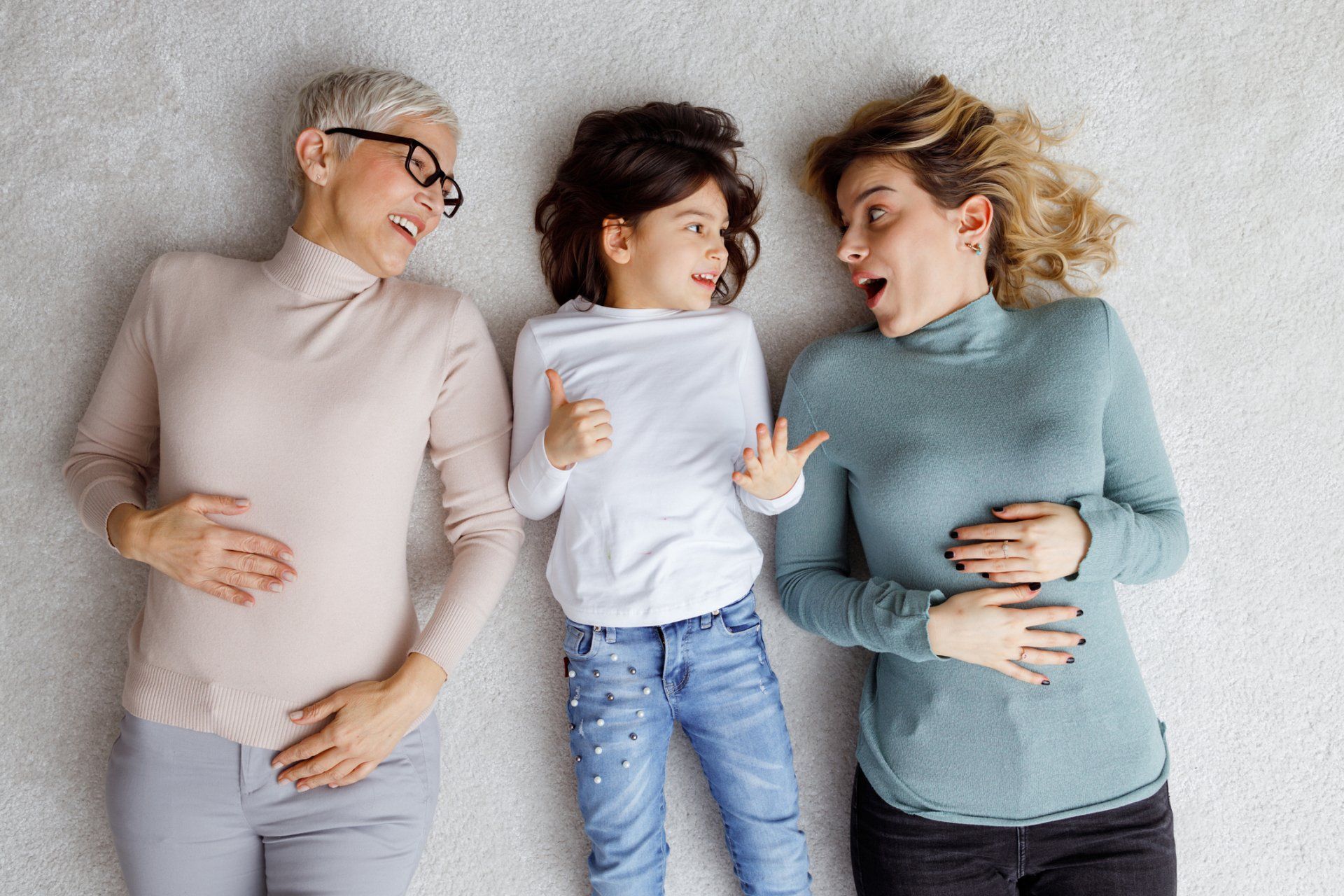 Girl with Her Mother and Grand Mother Lying on the Floor — St. Louis, MO — Barefoot Carpet Company