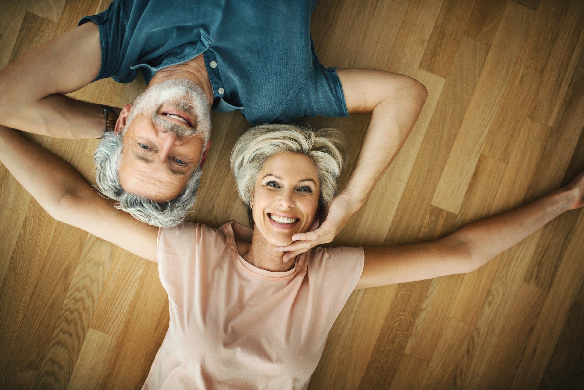 Old Couple Lying on the Floor — St. Louis, MO — Barefoot Carpet Company