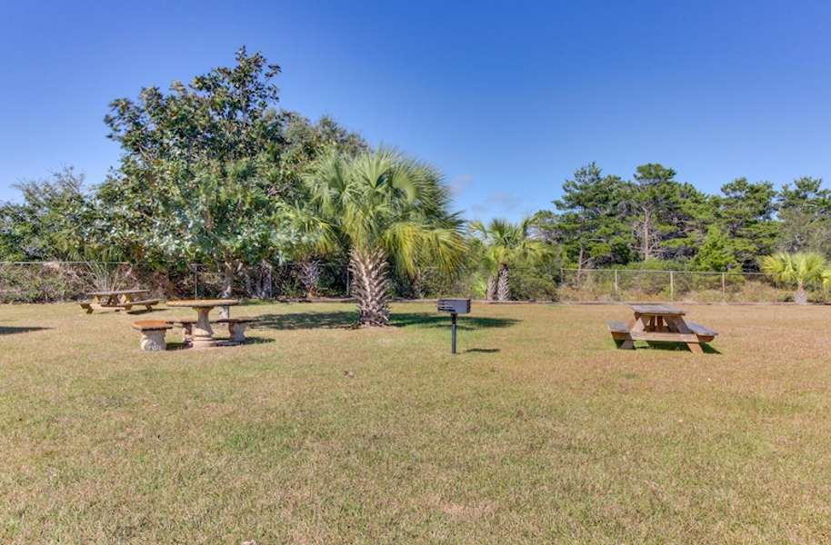 picnic area with barbecue and grass area