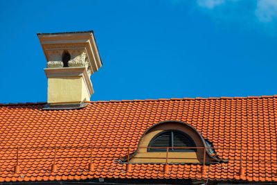 Waterproof Chimney — Building Roof Covered with Red Tiles in Orlando, FL