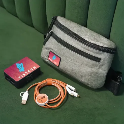 Gray fanny pack, portable charger, and orange cable with white connectors; all labeled with 