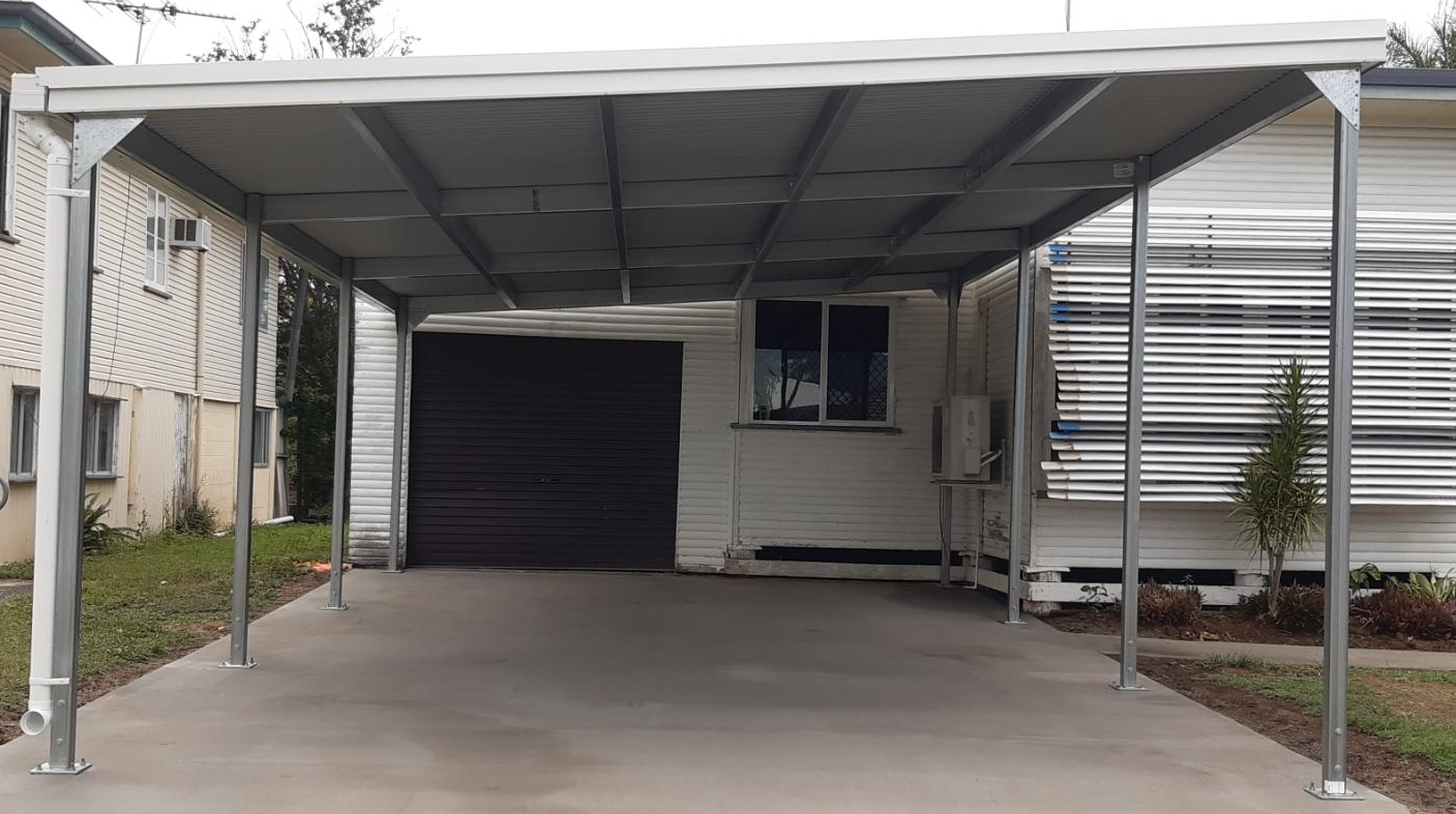 There is a carport in front of a house.