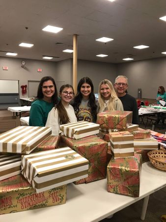 Gift Wrap Volunteers Good News of Christmas