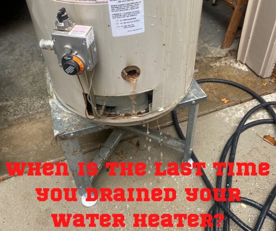 A water heater is sitting on top of a metal stand.