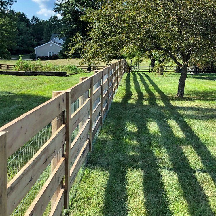 Wooden Fence In A Landscape — Shelbyville, KY — Shuck Fence Company