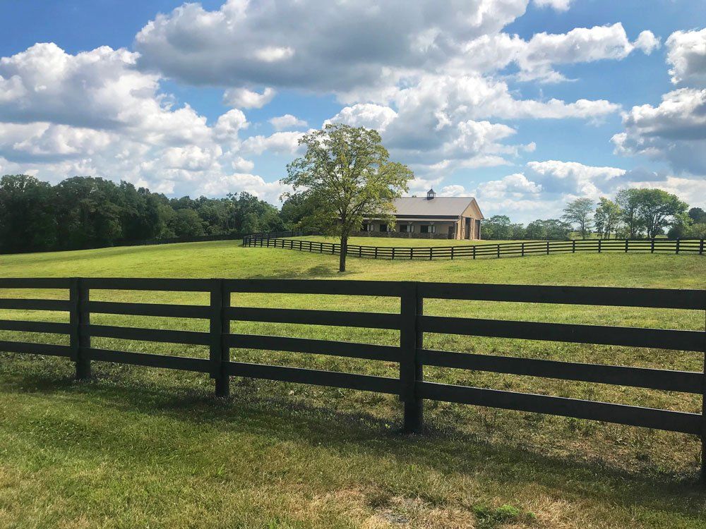 A Long Dark Green Fence — Shelbyville, KY — Shuck Fence Company