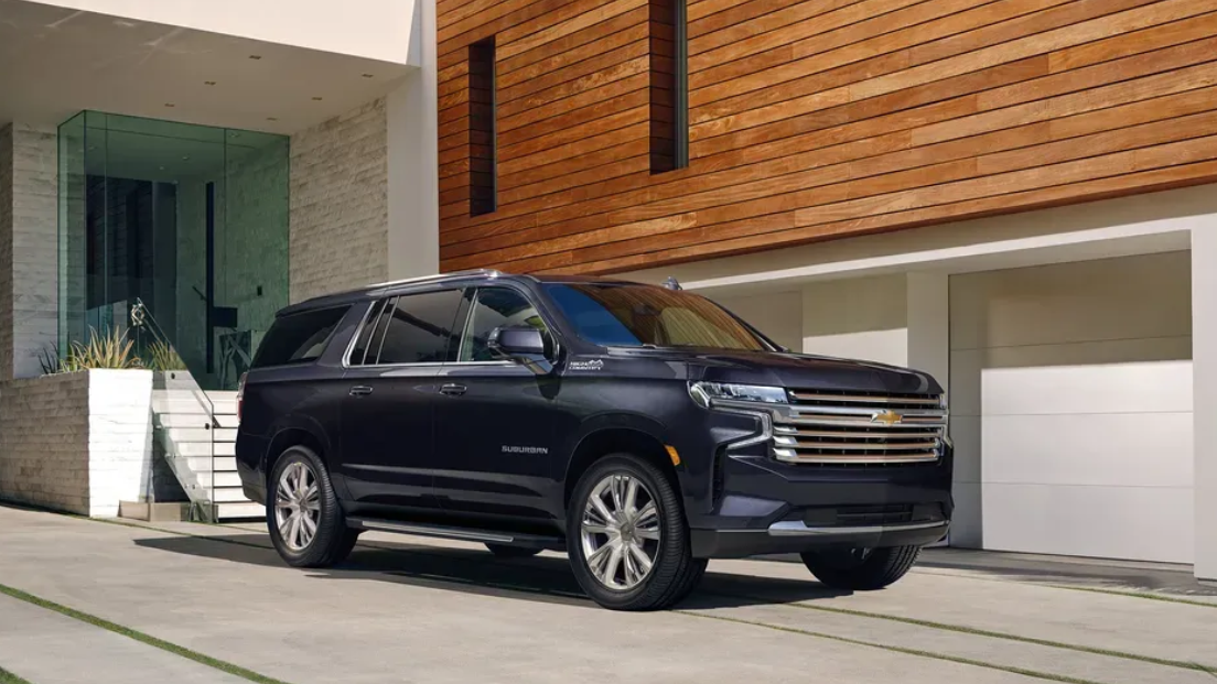 A black mercedes benz s class is parked in a parking lot.