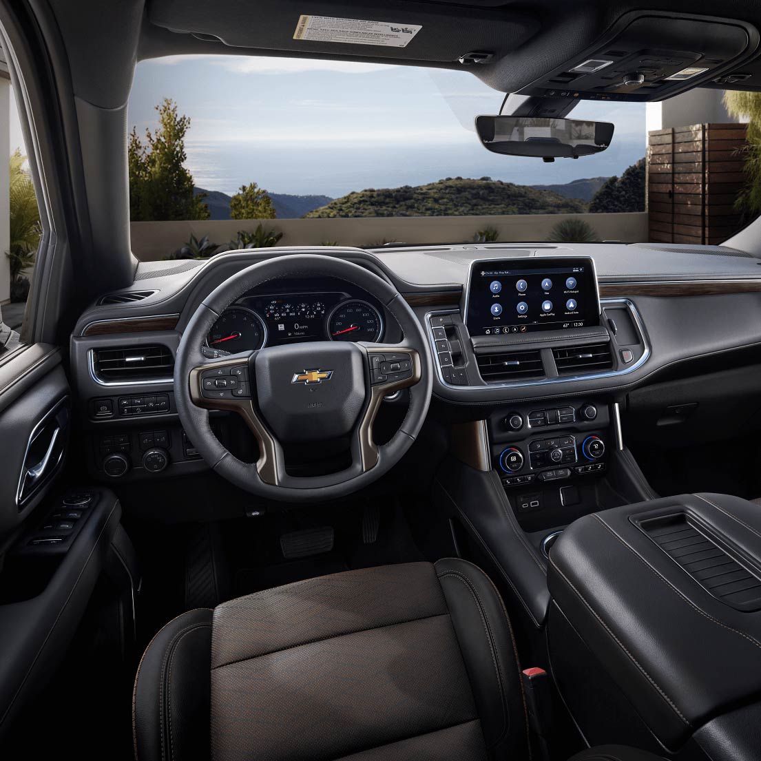 The inside of a car with a steering wheel and dashboard