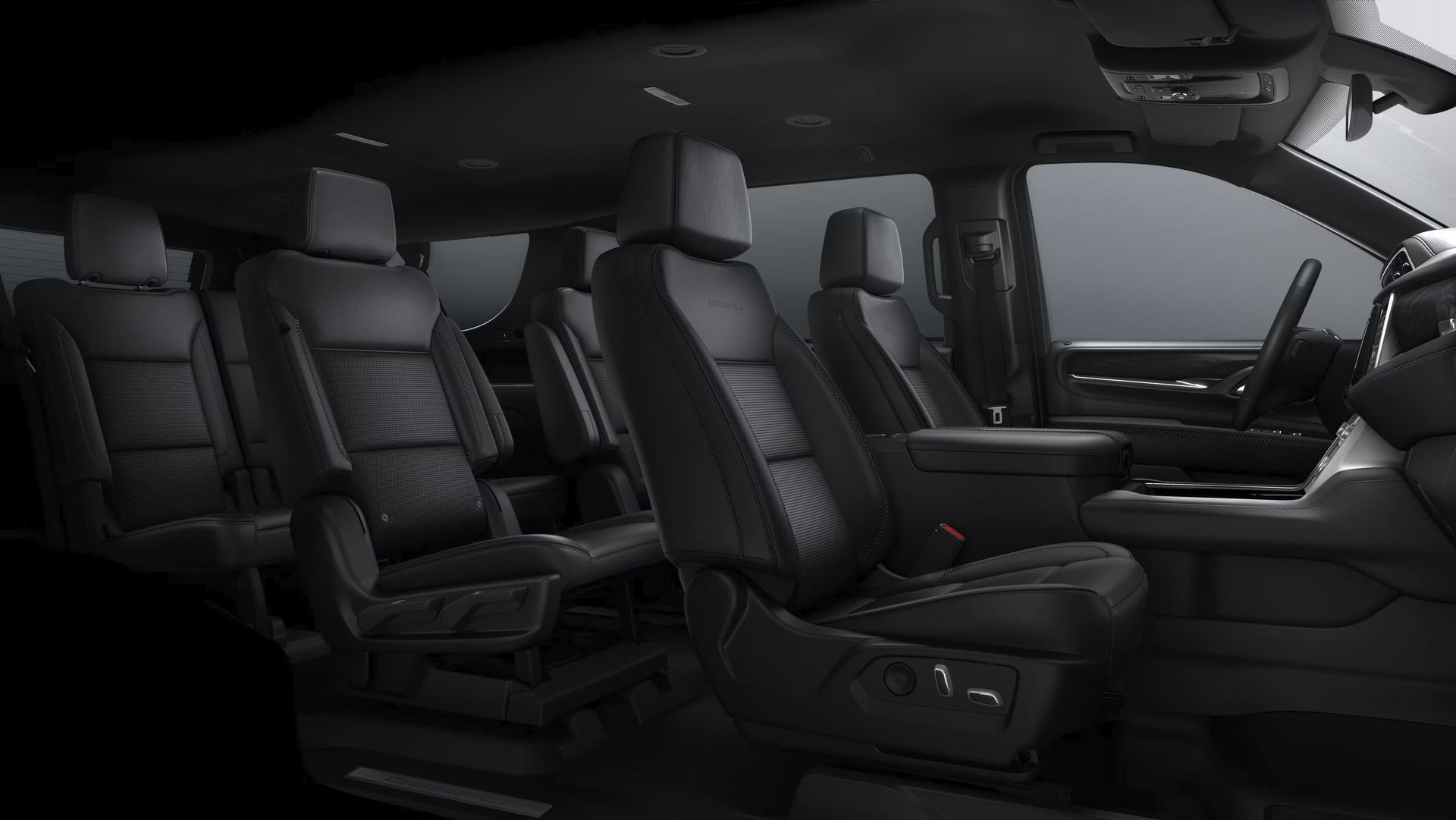 The interior of a gmc yukon is shown in black and white.