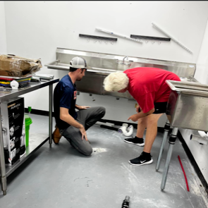 A plumber performing a repair in Stockbridge, GA