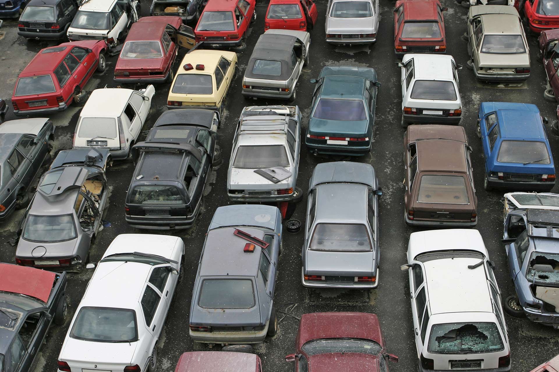 A lot of cars are parked in a parking lot