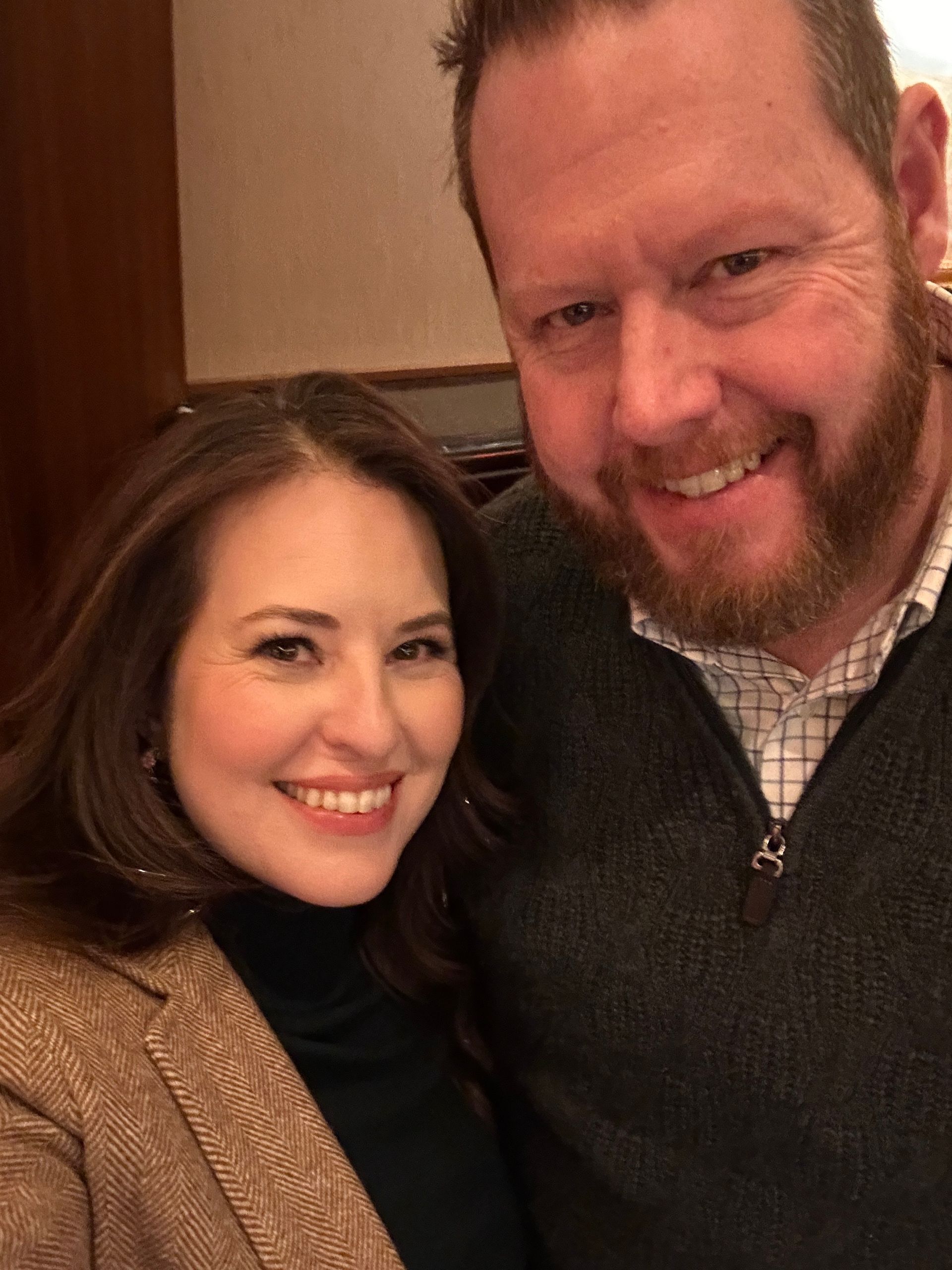 Photo of Cathy and Travis, the owners of Luxe Cosmetic Studios, smiling together and showcasing their dedication to the business.