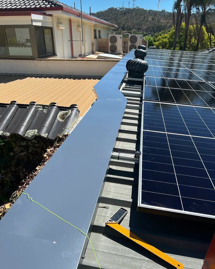 Solar Panels and Metallic Flashing Installed on a Rooftop — Des Mullins Electrical & Solar in Wagga Wagga, NSW