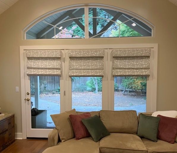 A Living Room with A Couch and A Large Window