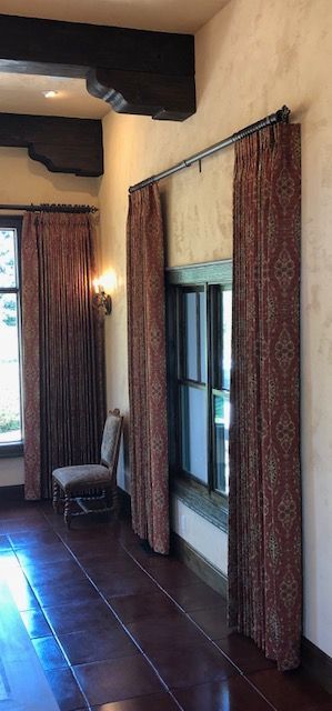 A Room with A Chair , Curtains and A Window.