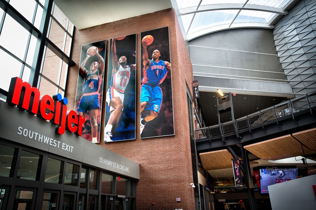 Meijer store entrance with basketball player portraits, and a glass ceiling.