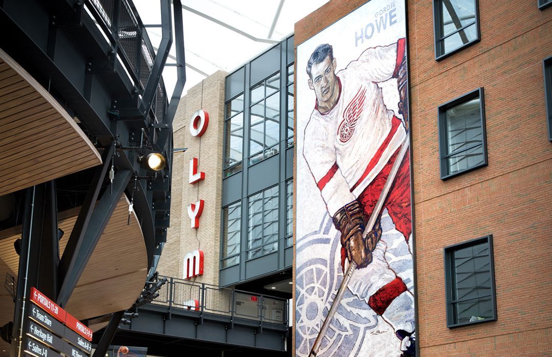 Mural of hockey player outside Little Caesars Arena in Detroit.