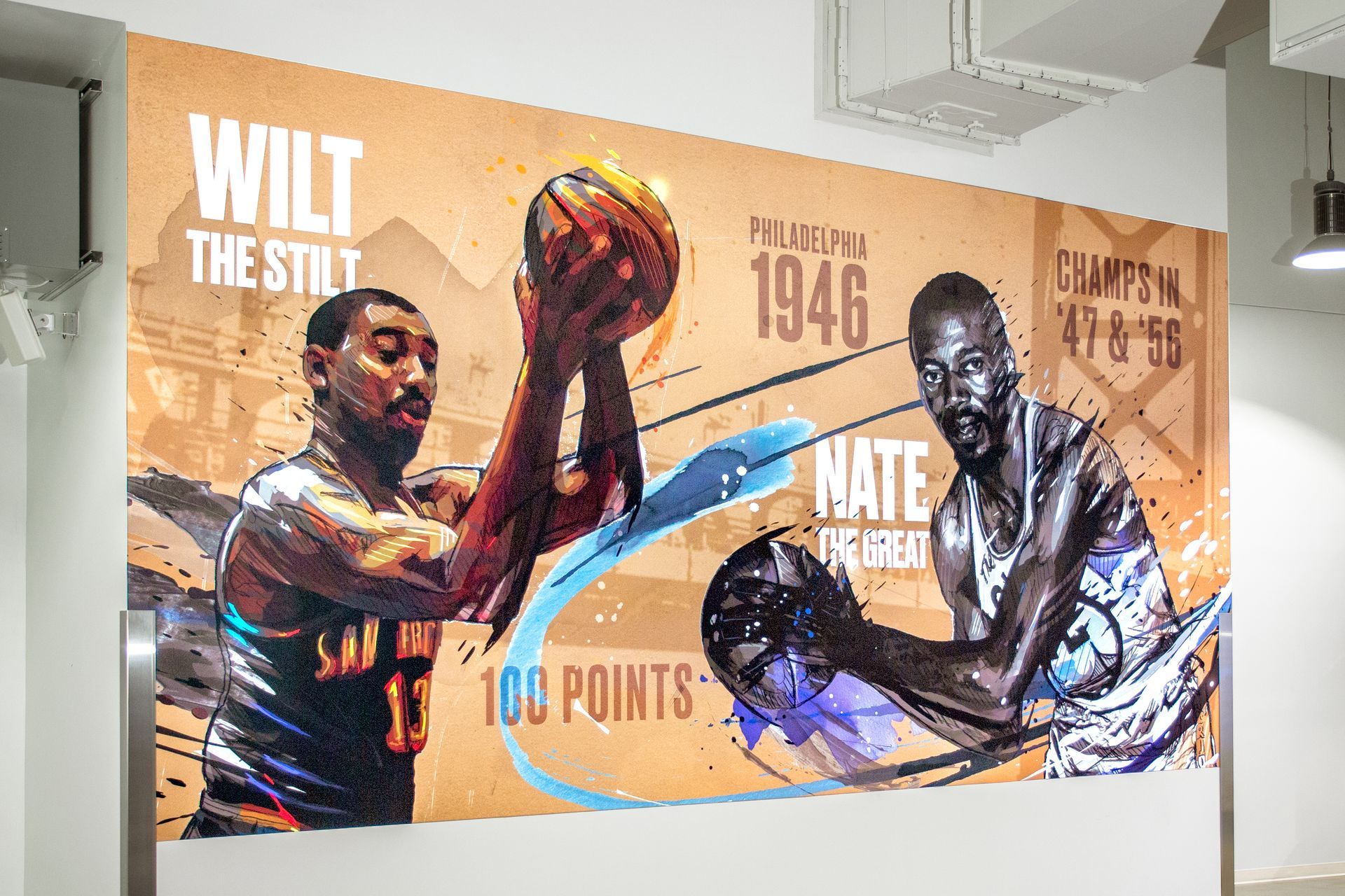 Mural of Wilt Chamberlain and Nate Thurmond, basketball players, with text: