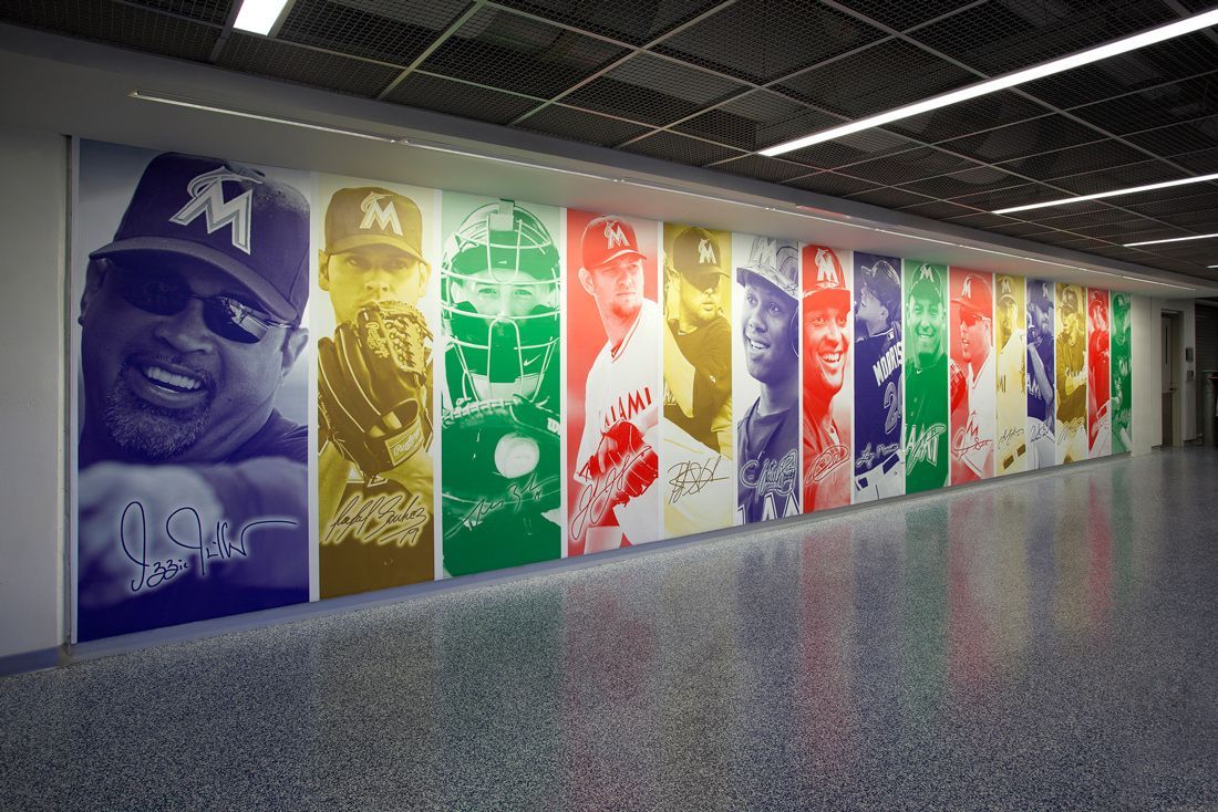 Mural of baseball players in colorful panels. Wall inside a building.