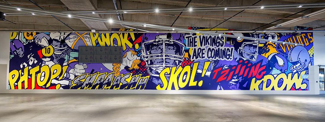 A large mural in a room with the words