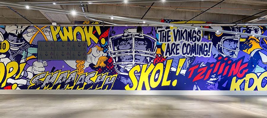 A comic book-style mural in a garage that reads