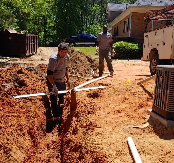 Two Workers with Pipes — Aiken, SC — Addie’s Septic Tank