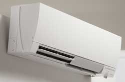 Prevett Heating and Cooling |A white air conditioner is hanging on a white wall.