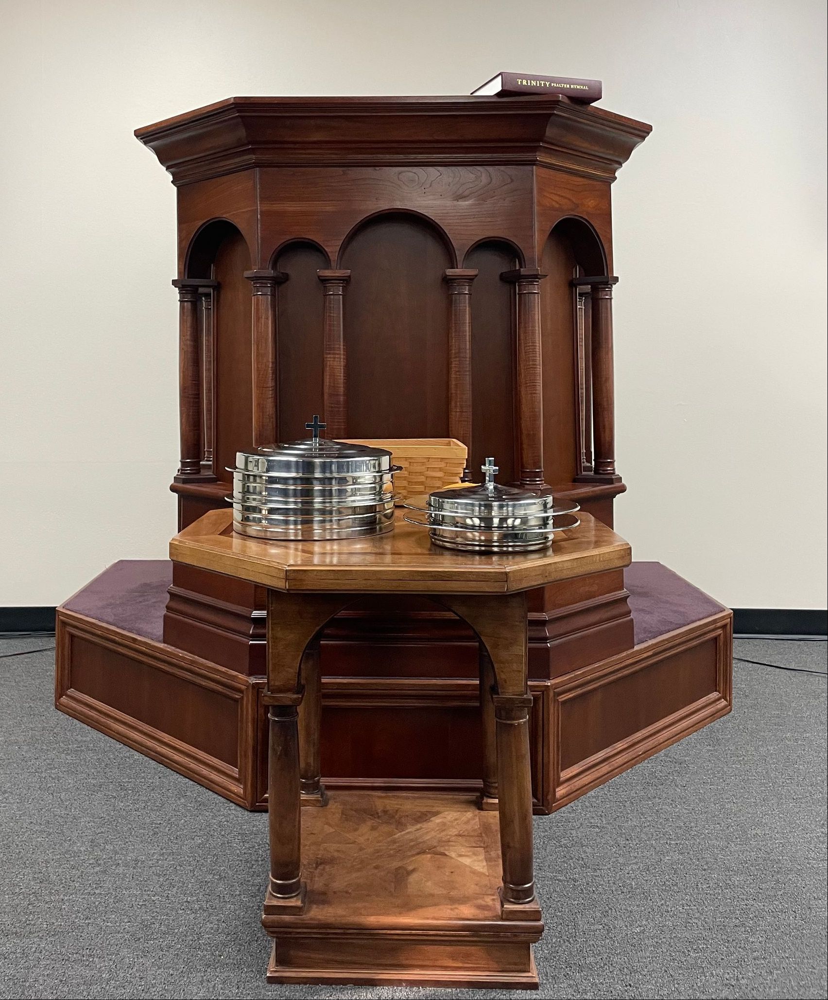 The pulpit and the communion table in our worship space.