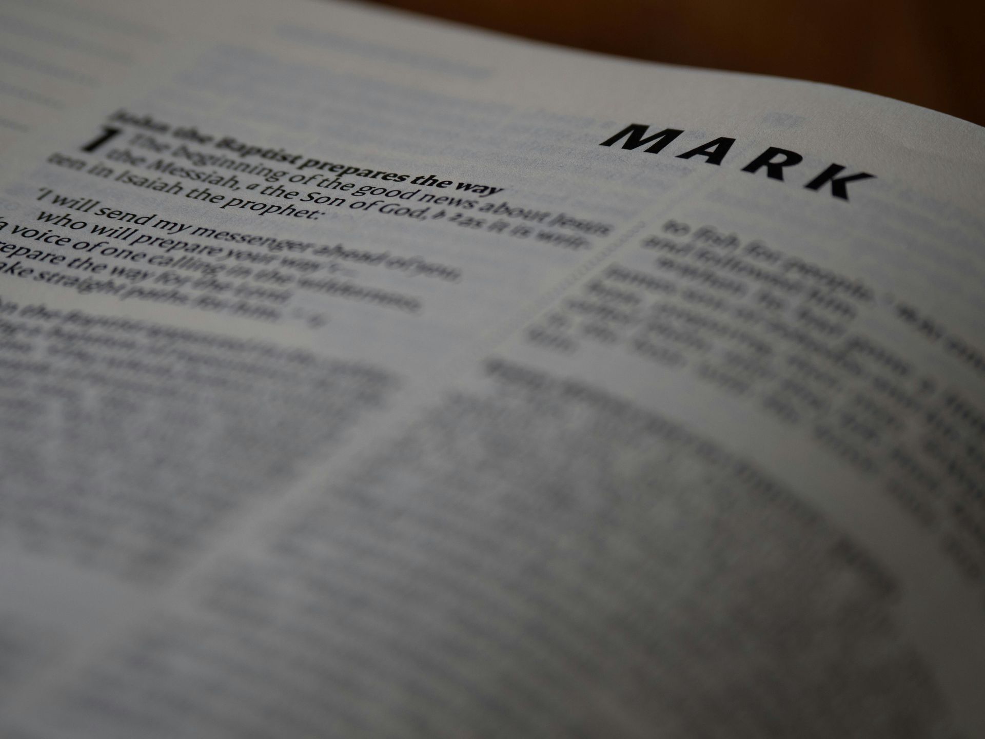 A picture of the Bible, open to the Gospel of Mark. 