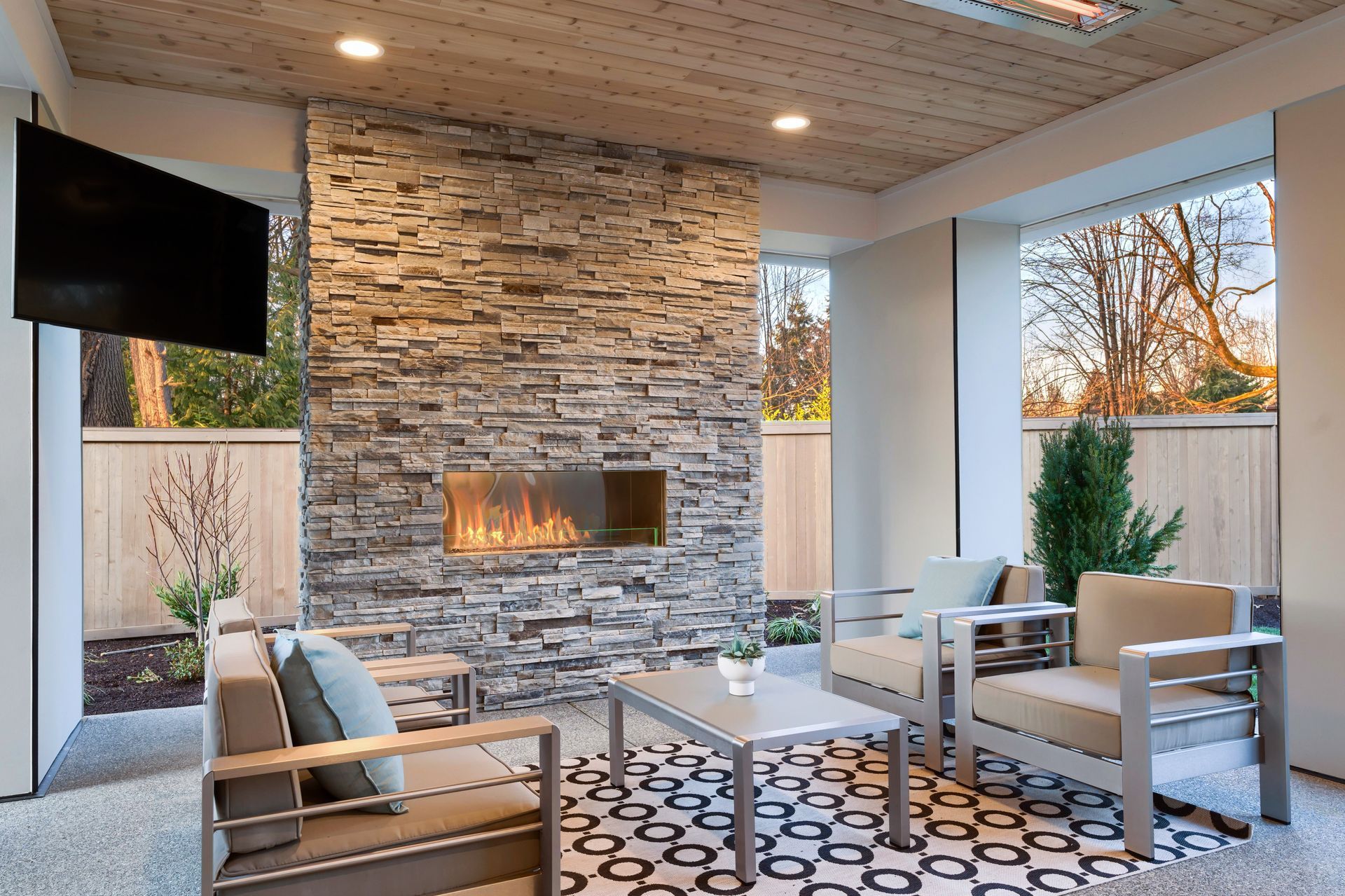 A living room with a fireplace and a flat screen tv