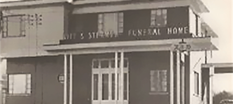 a black and white photo of a funeral home .