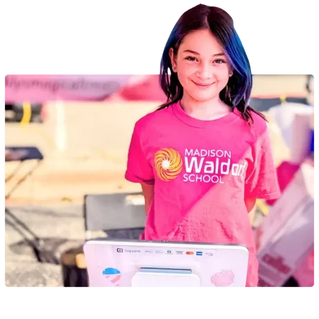 A girl wearing a pink madison walden school shirt